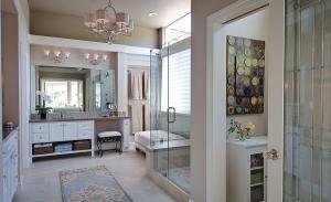 A range of porcelain, glass and mosaic tile create a sophisticated master bath design in a private residence located in 